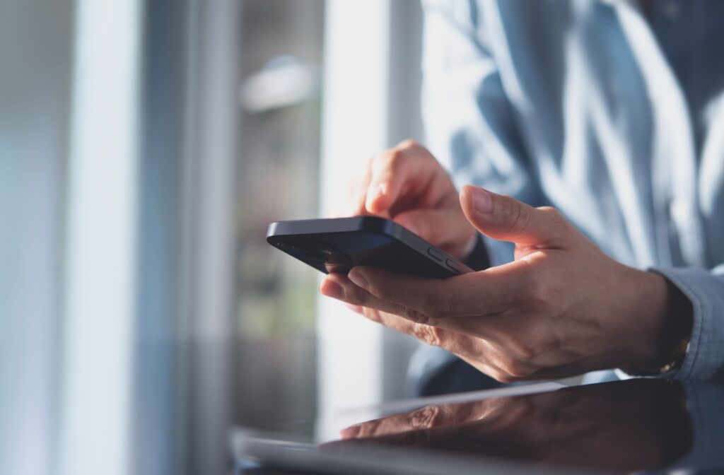 A close up of someone using their phone